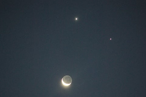 While binoculars or telescopes can enhance the view, the triangle will be easily visible to the naked eye