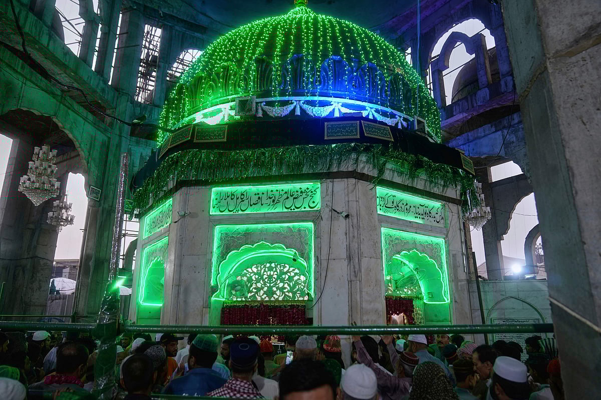 Devotees gather at the shrine of Hazrat Ali Hajveri, popularly known as Data Ganj Bakhsh, in Lahore, Pakistan, to mark the three-day annual festival, or Urs, celebrating the life of the revered mystic and scholar. Drumming, dancing, and dazzling lights bring the centuries-old tradition of honoring Sufi saints vividly to life, as pilgrims from across the country join in rituals, prayers, and devotional music, creating a vibrant and spiritual atmosphere that captures both faith and festivity.