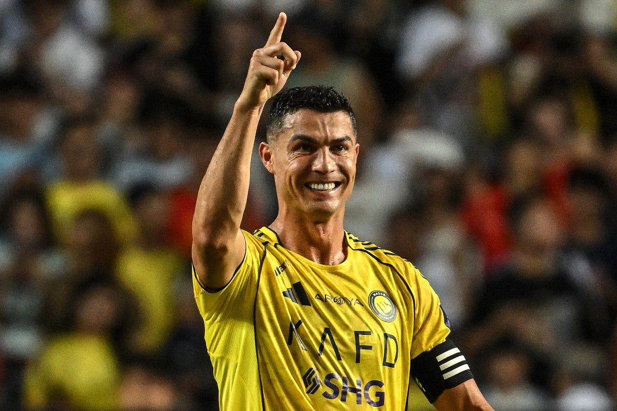Al-Nassr's Cristiano Ronaldo celebrates after scoring his team's first goal during the Saudi Super Cup final football match between Al-Nassr and Al-Ahli at the Hong Kong Stadium in Hong Kong on August 23, 2025.
