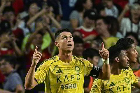Al-Nassr's Cristiano Ronaldo celebrates after scoring his team's first goal during the Saudi Super Cup final football match between Al-Nassr and Al-Ahli at the Hong Kong Stadium in Hong Kong on August 23, 2025.