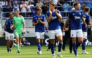 Everton's English midfielder Kiernan Dewsbury-Hall (L) jokes with Everton's English goalkeeper Jordan Pickford after the English Premier League football match against Brighton and Hove Albion at Hill Dickinson Stadium in Liverpool, north west England on August 24, 2025.