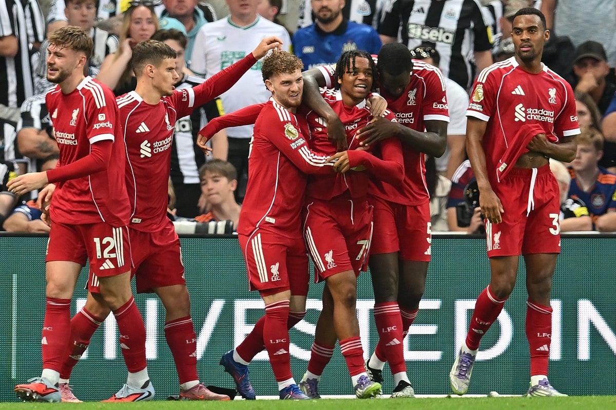 Liverpool's English striker Rio Ngumoha (centre) celebrates with teammates after scoring their third goal during the English Premier League match against Newcastle United at St James' Park on Monday.
