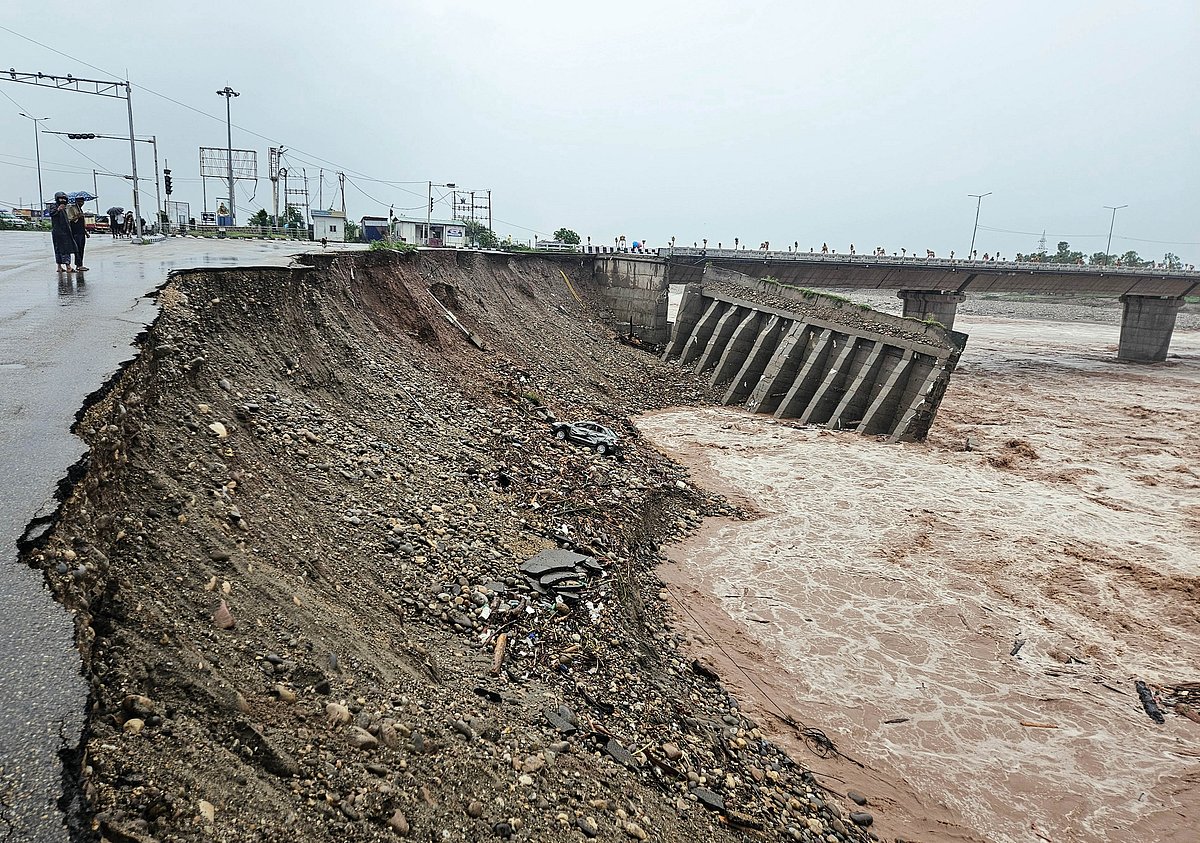 Road near Jammu’s fourth Tawi Bridge washed away after heavy rains on Wednesday. More than 3,500 residents were evacuated in a swift rescue as flash floods and waterlogging hit the region.