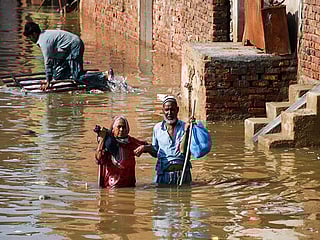 Rescuers in boats raced through submerged villages in Pakistan’s Punjab province on Thursday after three major rivers—the Ravi, Sutlej and Chenab—burst their banks for the first time in 38 years, displacing nearly 250,000 people and affecting 1.2 million others.