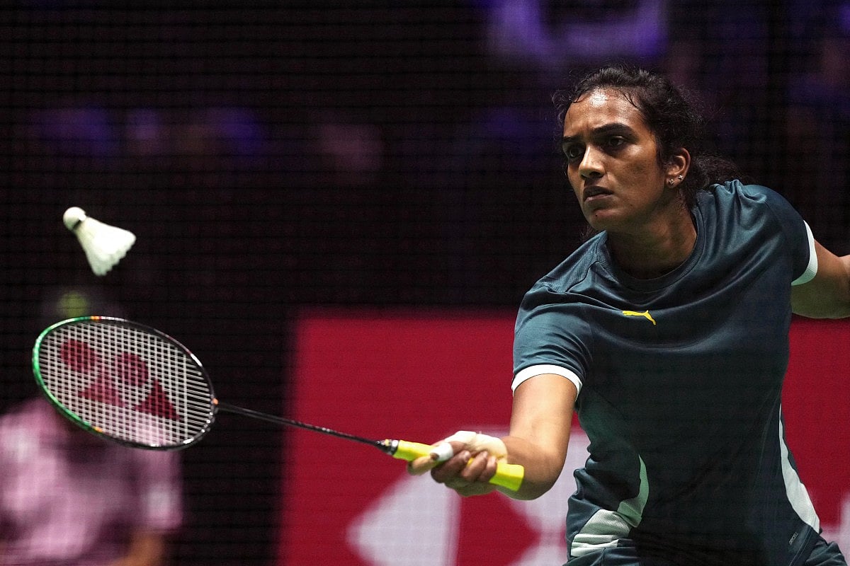 India's Pusarla Venkata Sindhu returns the shuttlecock to Indonesia's Putri Kusuma Wardani during the women's single quarter final match at the Badminton BWF World Championships at the Adidas Arena in Paris, on August 29, 2025.
