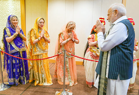 Prime Minister Narendra Modi receives a rousing welcome from the Japanese artists upon his arrival at a hotel in Tokyo, Japan, Friday, August 29, 2025. 