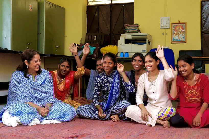 In this undated photo provided by the Ramon Magsaysay Award Foundation, Safeena Husain, left, founder and board member of the Foundation to Educate Girls talks to a group in Rajasthan, India. 