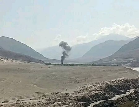A distant shot of the site of the helicopter crash