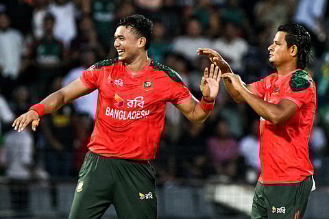 Bangladesh’s Taskin Ahmed (L) celebrates with teammate after taking the wicket of Netherlands' Vikramjit Singh during the second Twenty20 international cricket match between Bangladesh and Netherlands at the Sylhet International Cricket Stadium in Sylhet on September 1, 2025.