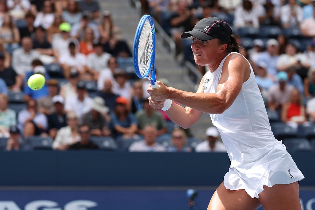 Iga Swiatek, of Poland, returns a shot against Ekaterina Alexandrova, of Russia, during the fourth round of the US Open tennis championships, Monday, Sept. 1, 2025, in New York. 