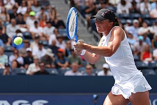 Iga Swiatek, of Poland, returns a shot against Ekaterina Alexandrova, of Russia, during the fourth round of the US Open tennis championships, Monday, Sept. 1, 2025, in New York. 