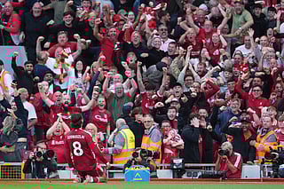 Liverpool's Dominik Szoboszlai celebrates after scoring his sides first goal during the English Premier League soccer match between FC Liverpool and FC Arsenal in Liverpool, England, Sunday, Aug. 31, 2025.