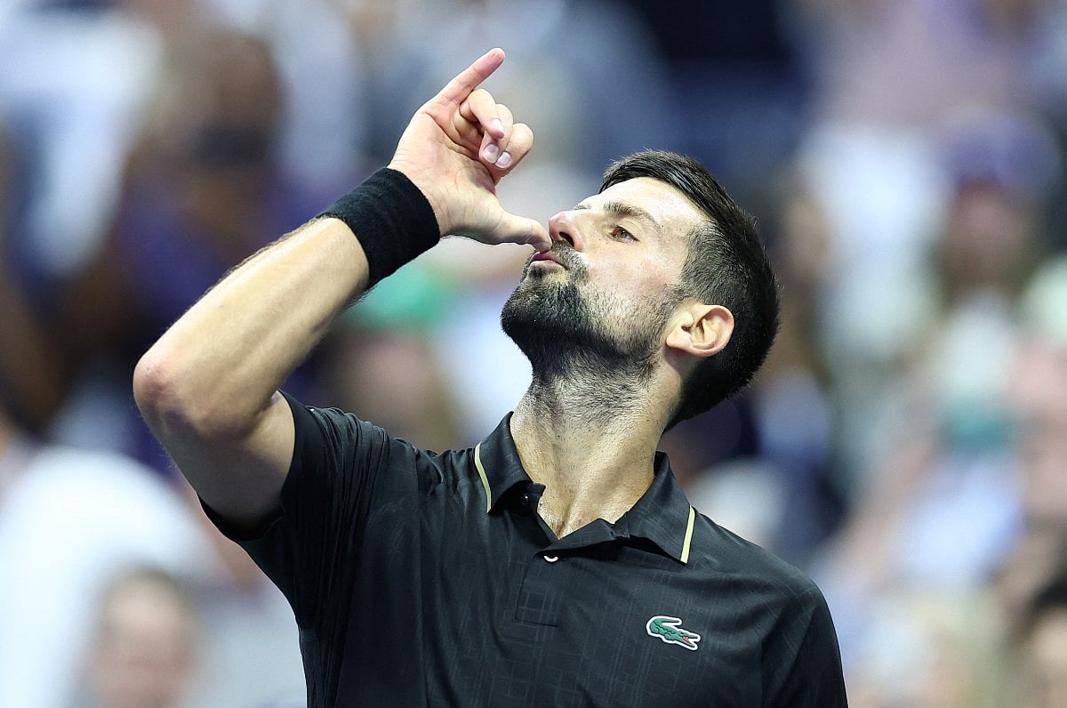Serbia's Novak Djokovic celebrates with dance moves he choreagraphed with his daughter for K-Pop song Soda Pop at Flushing Meadows on Tuesday.