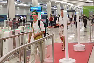 Passengers using 'Red Carpet' smart corridor, a biometric immigration system, at Dubai International Airport Terminal-3 that allows passengers to complete passport control in seconds. 