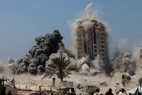 Smoke billows during Israeli strikes on tall building in Gaza City on September 5, 2025, amid the war between Israel and the Hamas militant movement.
