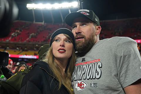 Kansas City Chiefs tight end Travis Kelce, right, is congratulated by Taylor Swift as they celebrate the Chiefs victory over the Buffalo Bills in the AFC Championship NFL football game, Jan. 26, 2025, in Kansas City.
