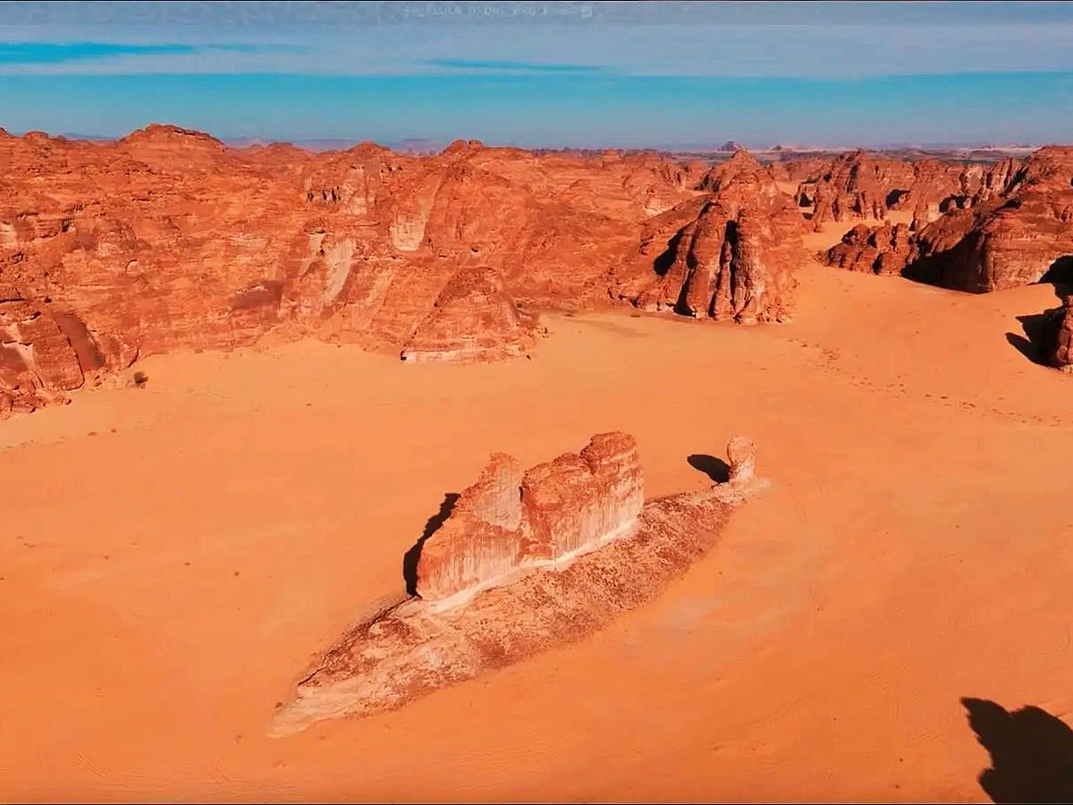 In Wadi Al-Fann, AlUla, stands one of Saudi Arabia’s most striking natural wonders — the Fish Rock. Nearly 200 meters long, the colossal sandstone formation resembles a giant sea creature stranded in the desert, captivating visitors with its surreal silhouette. When images first surfaced online, many speculated it was a fossilised prehistoric fish, sparking fascination and myth. Experts, however, point to erosion. According to the Royal Commission for AlUla, ancient rivers once shaped the rock as they flowed across Gondwana 500 million years ago. Today, Fish Rock remains a powerful symbol of AlUla’s timeless landscapes and geological heritage.