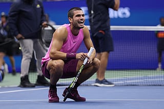 Carlos Alcaraz of Spain reacts after winning match point to defeat Jannik Sinner of Italy during their Men's Singles Final match on Day Fifteen of the 2025 US Open at USTA Billie Jean King National Tennis Center on September 07, 2025 in New York City.