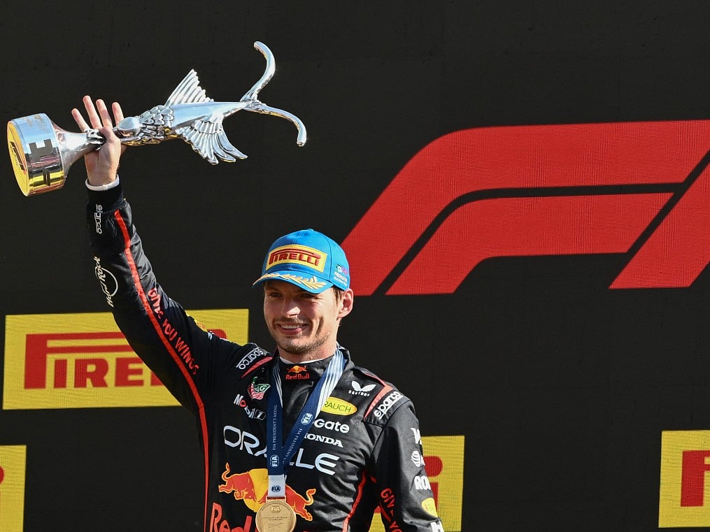 Red Bull Racing's Dutch driver Max Verstappen celebrates his victory on the podium after winning the Italian Formula One Grand Prix at the Autodromo Nazionale Monza circuit, in Monza, northern Italy, on September 7, 2025.