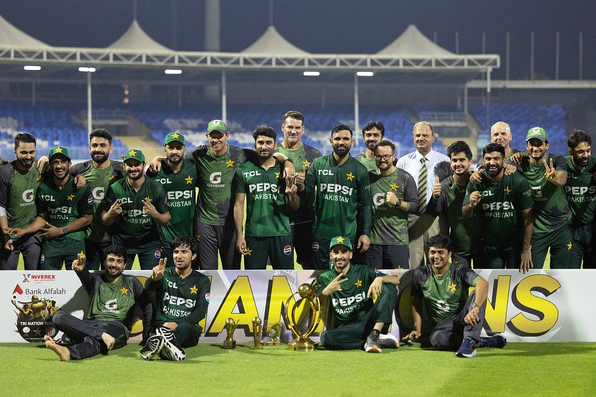 Pakistan's team pose with the trophy after winning the T20 international cricket match against Afghanistan in Sharjah on September 7, 2025.