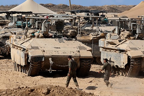 Israeli troops deploy at the border fence with the Gaza Strip in southern Israel, on September 9, 2025.