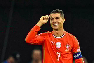 Portugal's forward #07 Cristiano Ronaldo (R) celebrates after scoring the 1-2 penalty goal as Hungary's midfielder #17 Callum Styles reacts during the 2026 World Cup qualifiers Europe zone group F football match between Hungary and Portugal on September 9, 2025 in Budapest, Hungary.