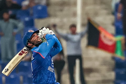 Afghanistan's Azmatullah Omarzai in action during the Asia Cup 2025 Twenty20 international cricket match against Hong Kong at the Sheikh Zayed Cricket Stadium in Abu Dhabi on September 9, 2025.