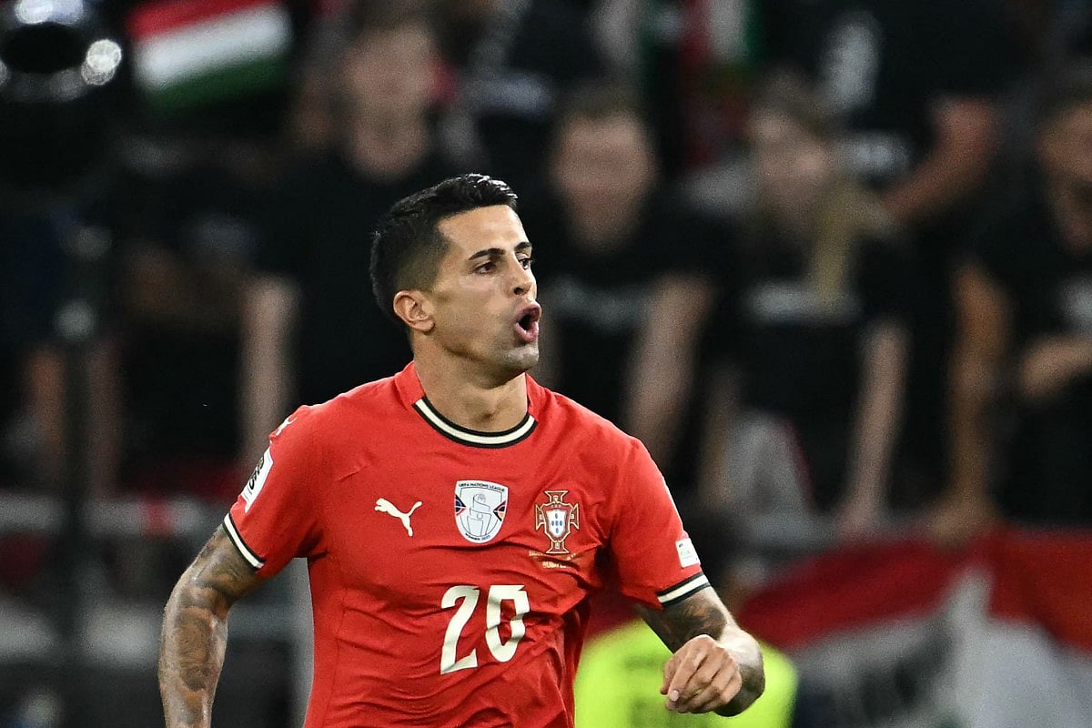 Portugal's defender #20 Joao Cancelo celebrates scoring the 2-3 goal during the 2026 World Cup qualifiers Europe zone group F football match between Hungary and Portugal on September 9, 2025 in Budapest, Hungary.