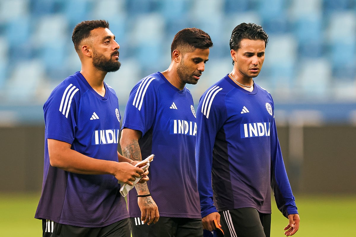 Indian captain Surya Kumar Yadav, Varun Chakaravarthy and Abhishek Sharma during a training session ahead of their first Asia Cup match against UAE at Dubai International cricket stadium.