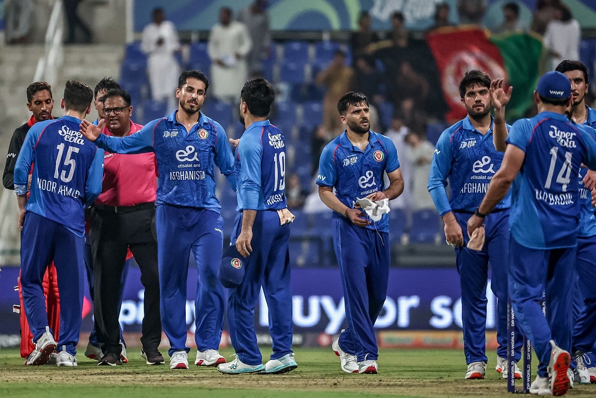 Afghanistan's players celebrate after winning the Asia Cup 2025 Twenty20 international cricket match between Afghanistan and Hong Kong at the Sheikh Zayed Cricket Stadium in Abu Dhabi on September 9, 2025.