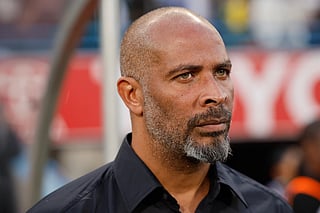 Nigeria's coach Eric Chelle stands for the national anthem ahead of FIFA World Cup 2026 Africa qualifiers group C match between South Africa and Nigeria at the Free State Stadium in Bloemfontein on September 9, 2025.