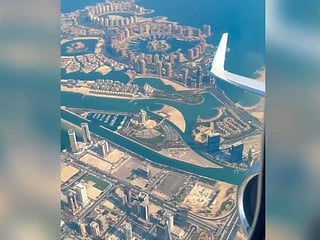 Footage shows a panoramic view of the skyline and urban landscape from above.