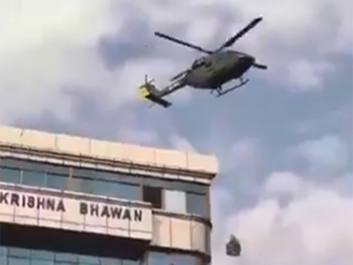 Nepal officials airlifted by helicopter ropes to escape protesters.