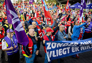 KLM ground crew members gather during a work stoppage at Schiphol Amsterdam Airport on September 10, 2025, due to dissatisfaction with a collective labor agreement KLM reached with three other unions.