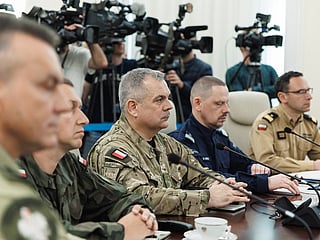 This September 10, 2025 hand out image released by the Polish Prime Ministers office shows General Wieslaw Kukula (C), Chief of the General Staff of the Polish Armed Forces attending an emegency meeting hosted by Poland's Prime Minister Donald Tusk (not in image) in Warsaw after drones violated Polish airspace. 