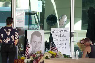 Well-wishers pay their respects at a makeshift memorial at the national headquarters of Turning Point USA shown after the shooting death of Charlie Kirk, the co-founder and CEO of the organisation, during a Utah college event Wednesday, Sept. 10, 2025, in Phoenix. 