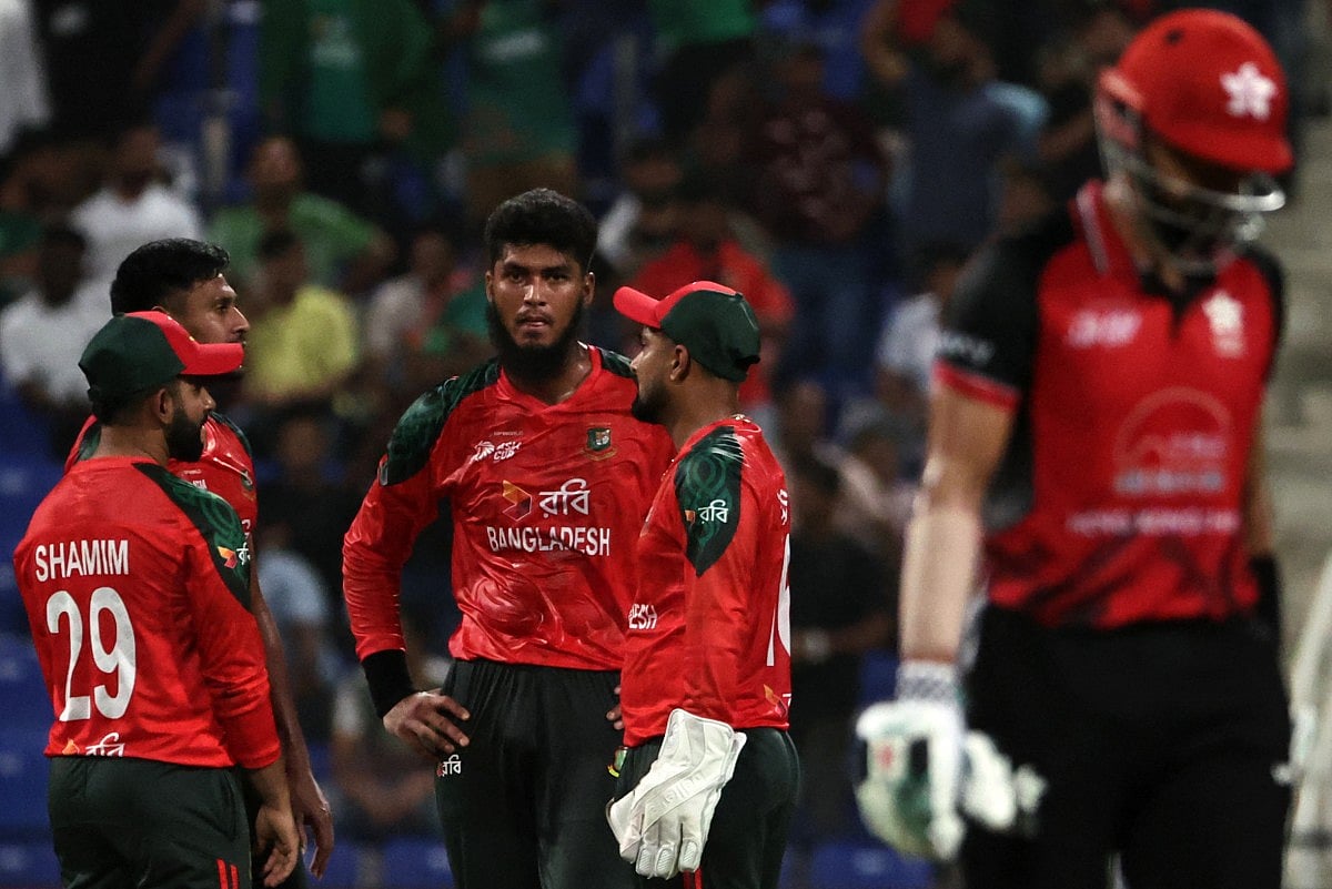 Bangladesh's players celebrate after the dismissal of Hong Kong's captain Yasim Murtaza (R) during the Asia Cup 2025 Twenty20 international cricket match between Bangladesh and Hong Kong at the Sheikh Zayed Cricket Stadium in Abu Dhabi on September 11, 2025.