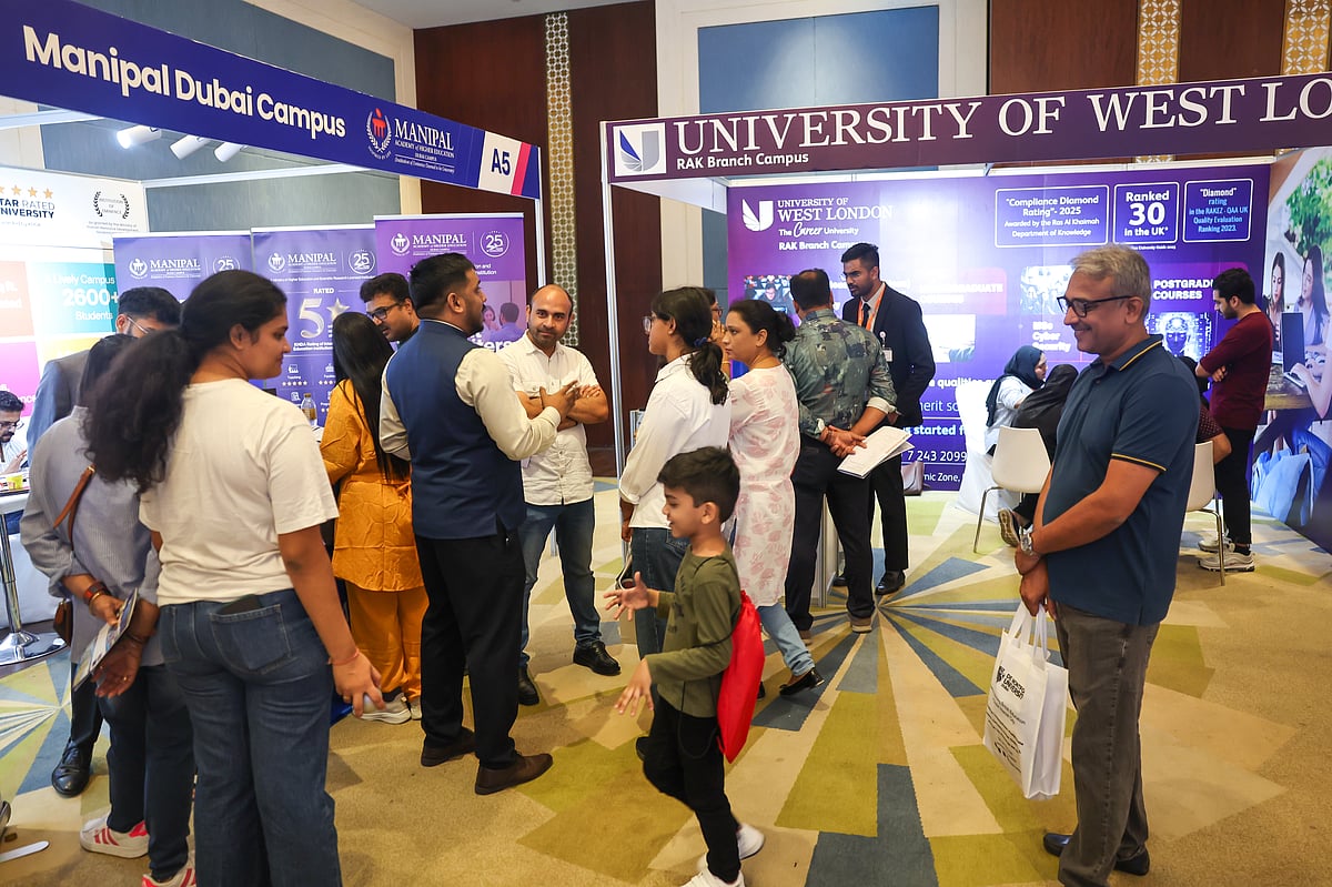 Students and families interacting with university representatives at Edufair's May edition 