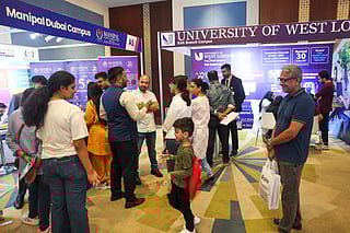 Students and families interacting with university representatives at Edufair's May edition 