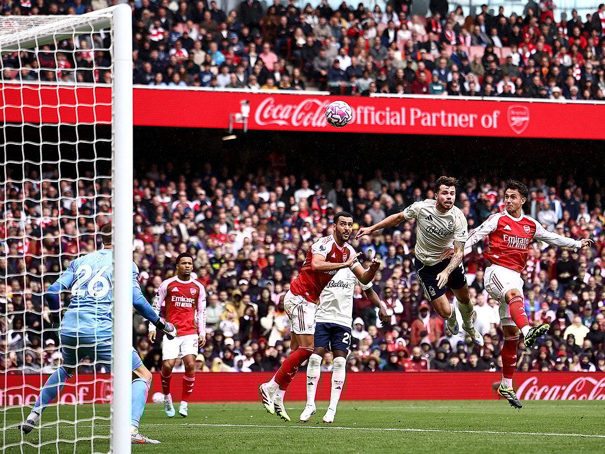 Arsenal defender Martin Zubimendi (R) scores the team's third goal during the English Premier League football match against Nottingham Forest at the Emirates Stadium in London on September 13, 2025. 
