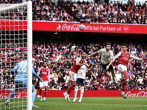 Arsenal defender Martin Zubimendi (R) scores the team's third goal during the English Premier League football match against Nottingham Forest at the Emirates Stadium in London on September 13, 2025. 
