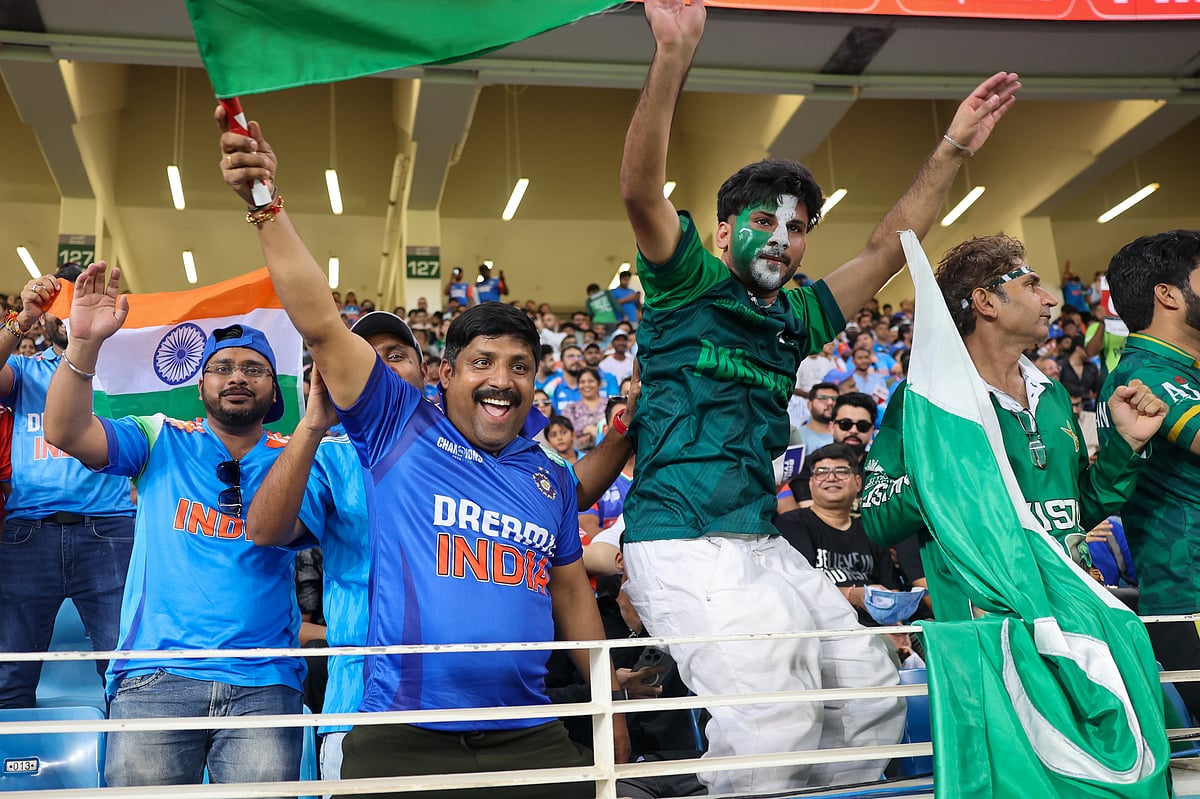 Indian and Pakistan fans togethether enjoying India vs Pakistan clash in the DP World Asia Cup match at Dubai International cricket stadium on Sunday.