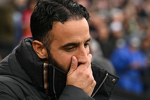 Manchester United's Portuguese head coach Ruben Amorim reacts in his seat during the English Premier League football match between Brentford and Manchester United at the Gtech Community Stadium in London on September 27, 2025.