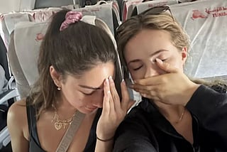 Brittney Dzialo and her friend getting a crash course on geography and airport mix-up