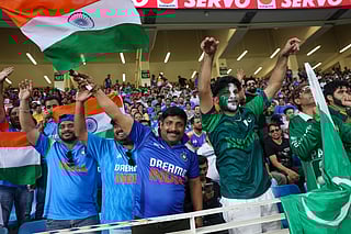 Indian and Pakistani fans together enjoy the India vs Pakistan clash at Dubai International Stadium during the DP World Asia Cup on Sunday. 