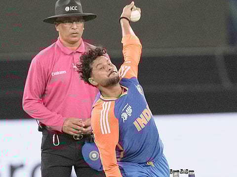 India's Kuldeep Yadav bowls a delivery during the Asia Cup cricket match against Pakistan at Dubai International Cricket Stadium, Sunday, September 14, 2025. 