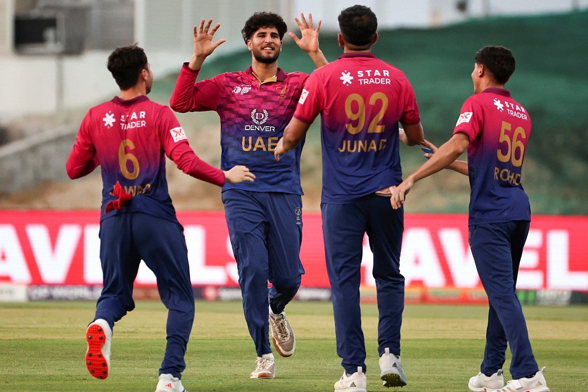 UAE's players celebrate after the dismissal of Oman's captain Jatinder Singh during the Asia Cup 2025 Twenty20 international cricket match between United Arab Emirates and Oman at the Sheikh Zayed Cricket Stadium in Abu Dhabi on September 15, 2025.