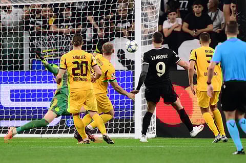 Juventus' Serbian forward #09 Dusan Vlahovic celebrates scoring his team's third goal during the UEFA Champions League first round day 1 football match between Juventus and Borussia Dortmund at the Allianz stadium in Turin, northern Italy, on September 16, 2025.