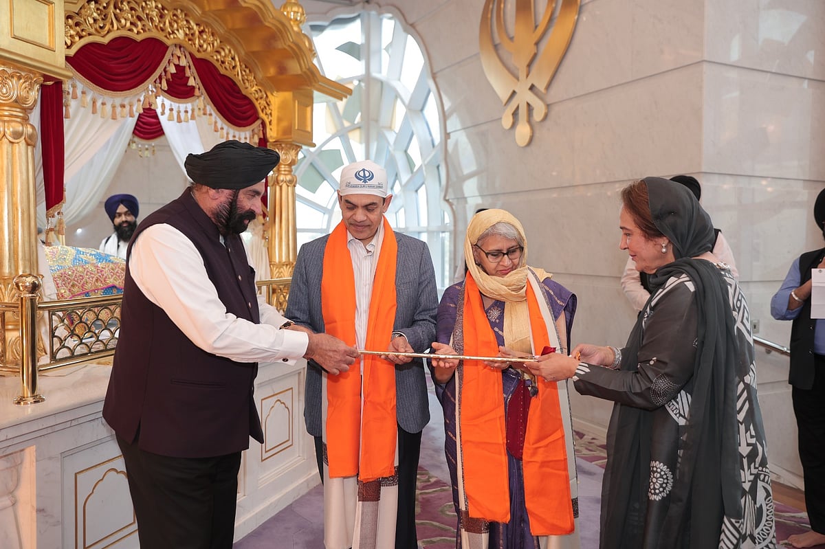 Sunjay Sundir and Vandana Sudhir receive the honourary robe and sword, Siripao and Siri Sahib, from Surender Singh Kandhari and Bubbles Kandhari at the Gurudwara on Monday evening. 