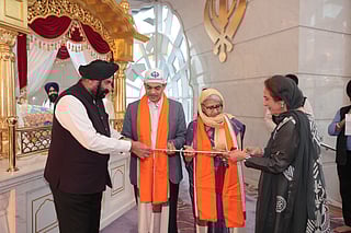 Sunjay Sundir and Vandana Sudhir receive the honourary robe and sword, Siripao and Siri Sahib, from Surender Singh Kandhari and Bubbles Kandhari at the Gurudwara on Monday evening. 